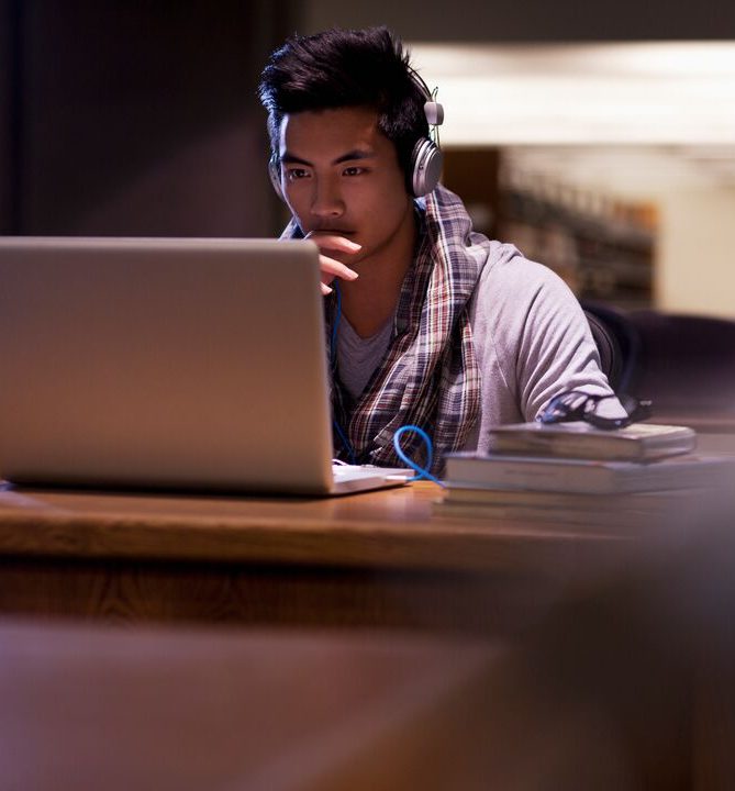 man sits at computer